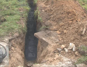 The roadside excavation for a broadband cabinet with Conducrete installed in duct trench