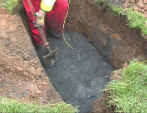 The roadside excavation for a broadband cabinet with a 16mm wire earth ring encased in Conducrete