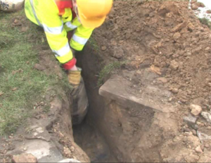The roadside excavation for a broadband cabinet with Conducrete poured into duct trench